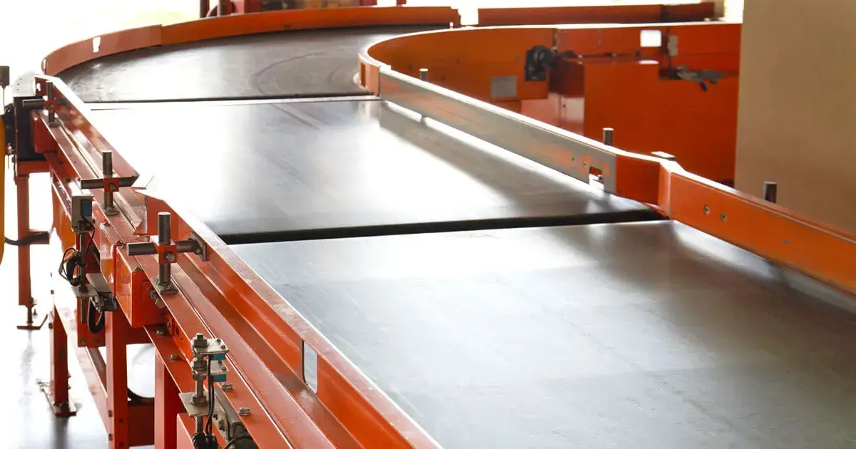 belt conveyor system with orange rails